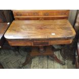 A 19th Century rosewood card table on quatrefoil base and brass castors