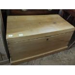 A large pine storage chest with integral drawer,
