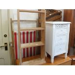 A white painted three drawer bedside chest, a folding wicker screen,