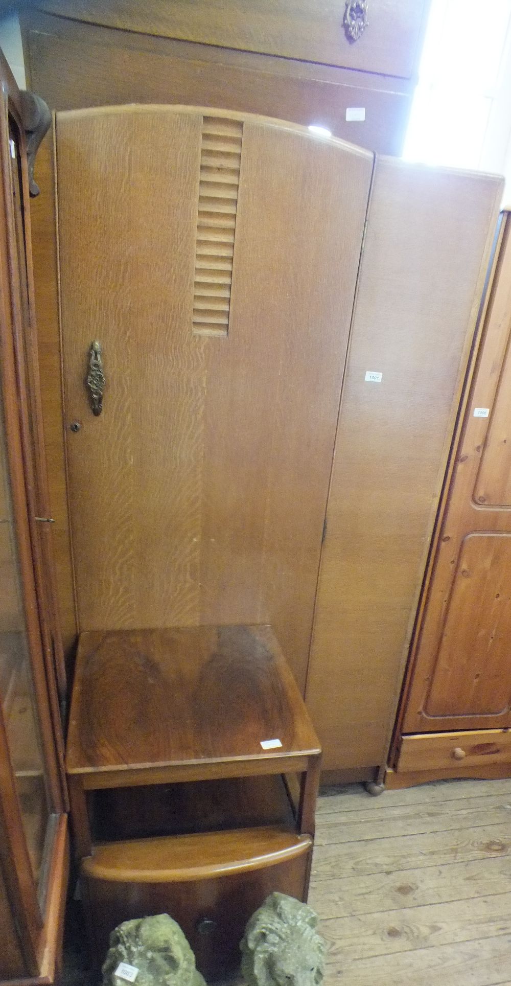 A 1930's oak single door wardrobe,