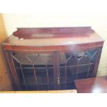 A mahogany two door glazed bow front display cabinet