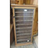 A pine rectangular glazed display cabinet with ten shelves,