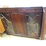 A reproduction mahogany astral glazed cupboard bookcase