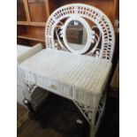 A white painted wicker dressing table with half moon mirror back,