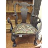 A mahogany and walnut veneered child's chair with scroll arms,