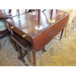 A mahogany Pembroke dining table on turned legs with single drawer and one faux drawer