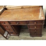 A Victorian mahogany pedestal desk with nine drawers