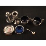 A mixed silver lot including small embossed decoration bud vase, small circular photo frame,