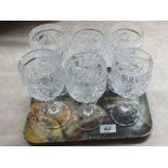 A set of six heavy cut glass wine glasses with etched birds decoration