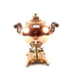 A large 19th Century twin handled globular copper samovar with brass tap and the shaped base with