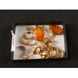 A mixed lot of 9ct gold and yellow metal earrings including amber and pearl set (some as found)