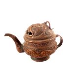 A Tibetan copper teapot with relief dragon decoration