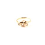 A 9ct gold illusion set three stone diamond ring,