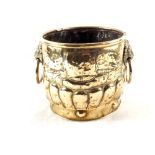A heavy 19th Century embossed brass jardiniere with gadrooning and lion mask ring handles,