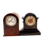 An Edwardian inlaid mahogany mantel clock plus a black metal cased clock