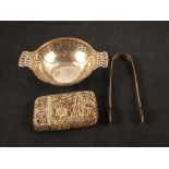 A pierced silver bowl,