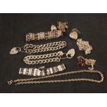 Ten various silver and white metal bracelets and necklaces including an amber droplet necklace