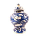 A Chinese blue and white Prunus pattern globular jar and cover,