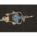 A large silver pendant with enamelled decoration in Art Nouveau style by Pat Cheney