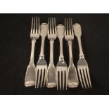 A set of six Georgian silver forks with crested handles,