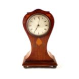 An Edwardian inlaid mahogany Art Nouveau mantel clock in waisted case
