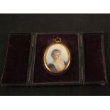 A miniature head and shoulders of a lady, initialled E.M.S.