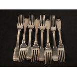 A set of six small Georgian silver forks plus two others (worn)