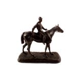 A cast metal figure of a horse and jockey,