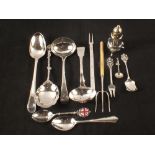 A collection of silver and silver plated cutlery including two Georgian ladles,