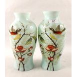 A pair of Victorian blue opal glass bird painted vases