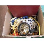 A box of various costume jewellery