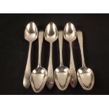 A good set of six Irish silver serving spoons with engraved design and crested handles