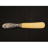 A silver handled ivory shoe horn