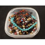 A tub of costume jewellery mainly bead necklaces including glass, turquoise,