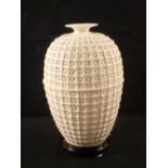 A highly reticulated white porcelain vase,