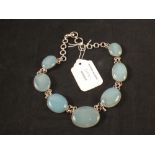 A large choker necklace set with oval polished blue stones (one link is as found)