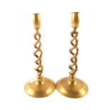 A pair of Edwardian brass barley twist candlesticks