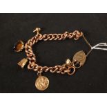 A 9ct rose gold curb link bracelet with 9ct gold padlock heart shaped clasp,