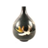 A Japanese green ground narrow neck vase with bi-metal bird decoration,