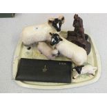 Four pottery sheep and rams,