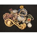 A bag of various costume jewellery plus a 9ct gold and silver ring