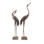 A pair of Japanese bronzed standing cranes,