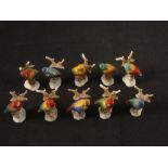 Ten porcelain bird place settings (some as found)