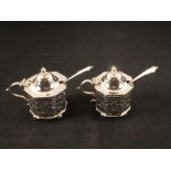 A pair of octagonal pierced silver mustards, Chester 1901 and 1903 plus two spoons,