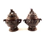 A pair of 19th Century Chinese bronzed Koros with kylin mounts