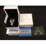 A boxed gents stainless steel Seiko Kinetic 50m wristwatch with paperwork