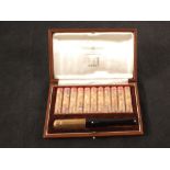 A cased Dunhill cigarette holder plus filters,