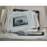 A folder containing a large quantity of unframed prints