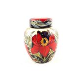 A boxed Moorcroft Peony pattern ginger jar by Philip Gibson, circa 2004, marks to base,