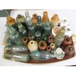 A large collection of branded glass bottles,
